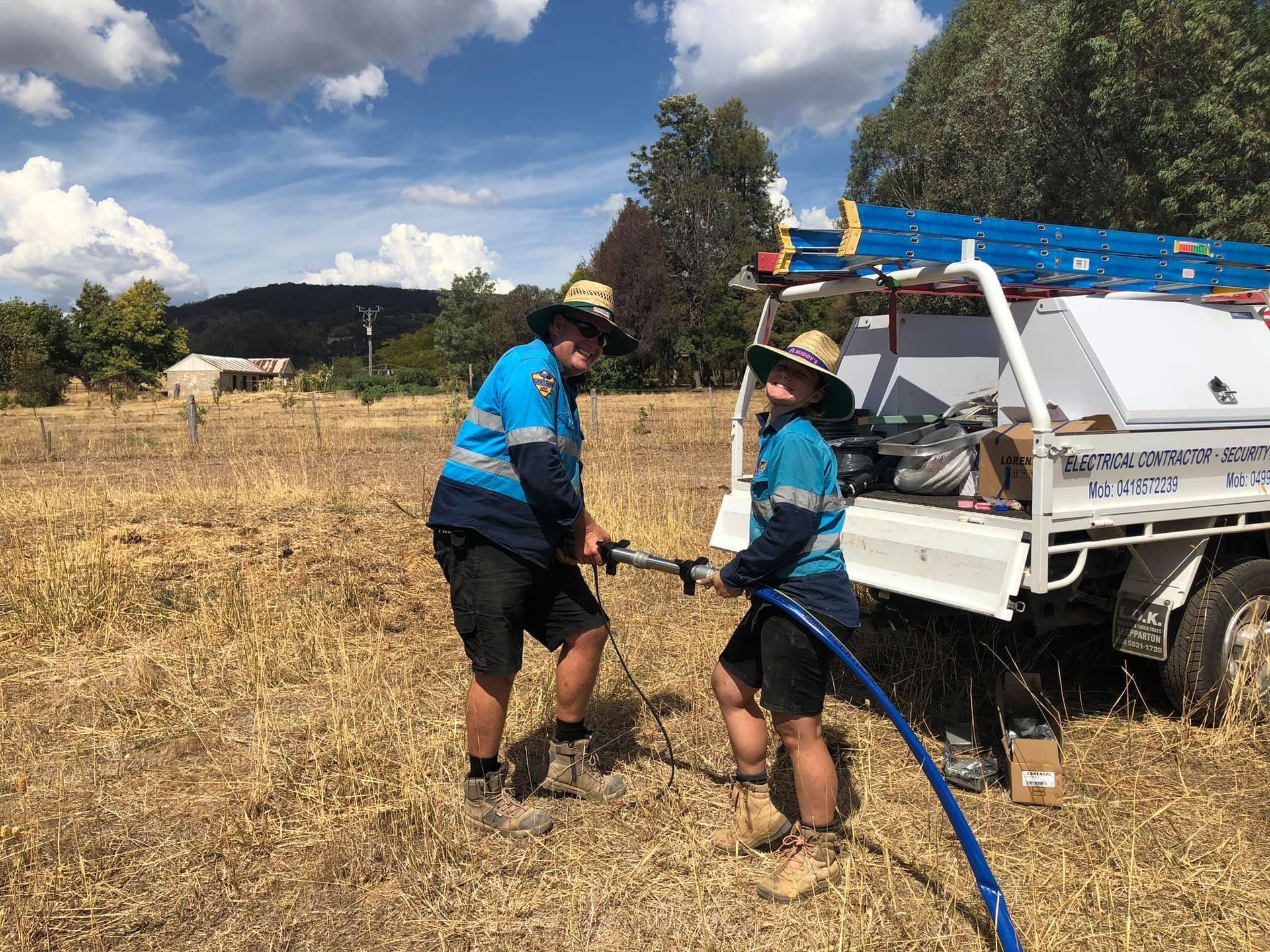 Electrician Man Installing Circuit Breaker At Home — John B Electrical In Wooragee VIC