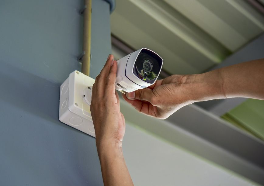 Technician Is Installing CCTV Camera System — John B Electrical In Wooragee VIC