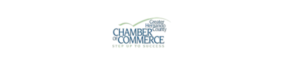 Chamber of Commerce logo with text, stylized mountain range above. "City of Success" text below.