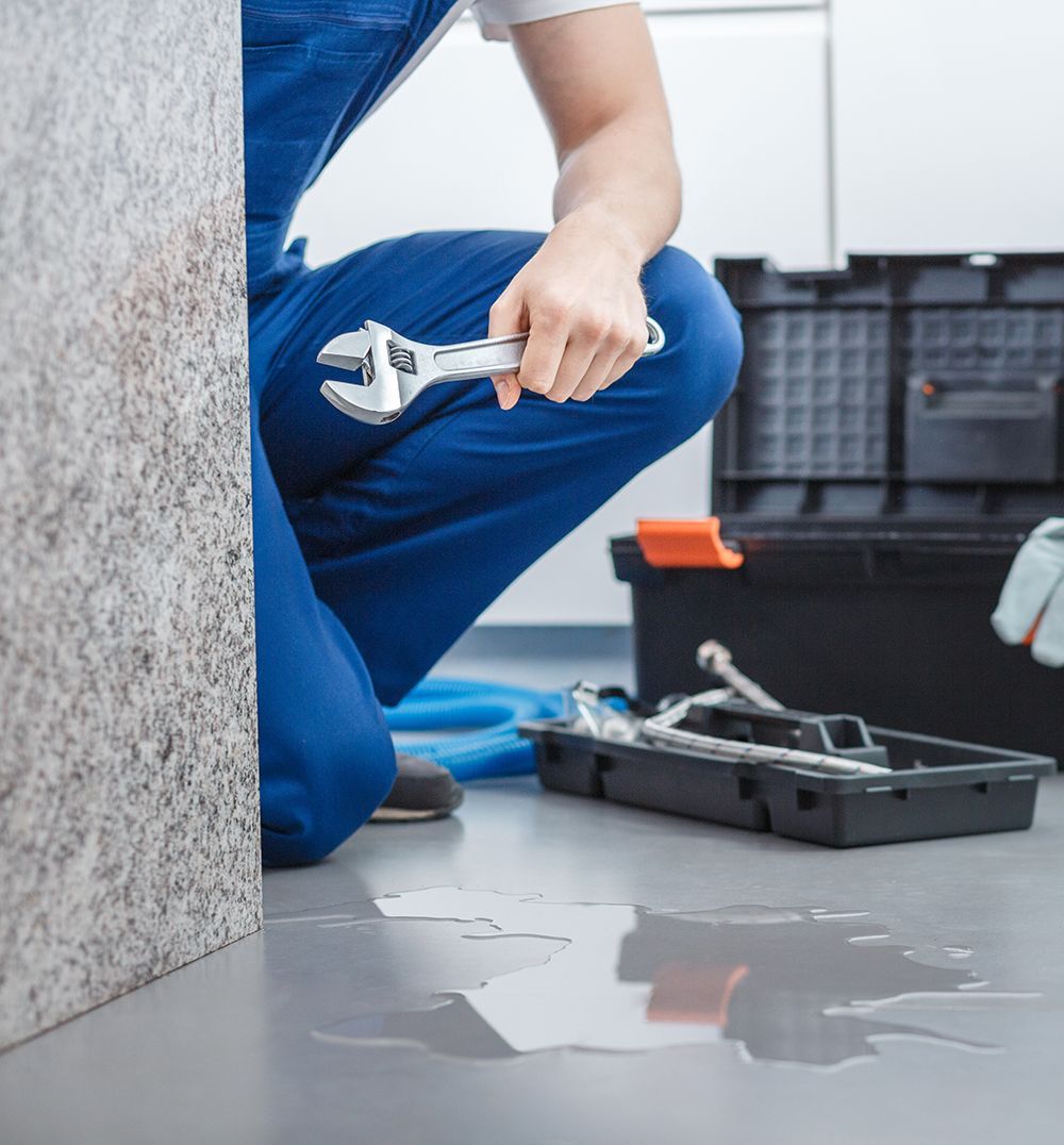 plumber fixing leak