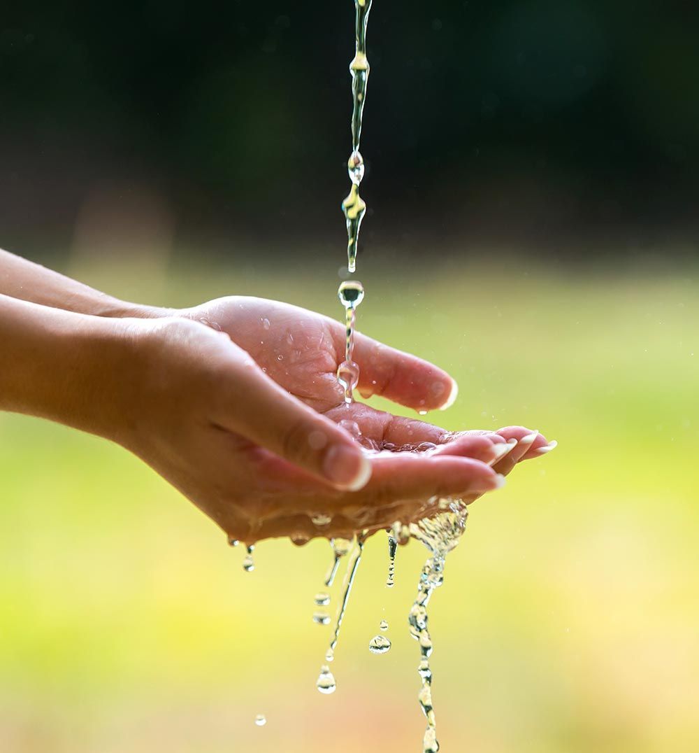 hands catching water