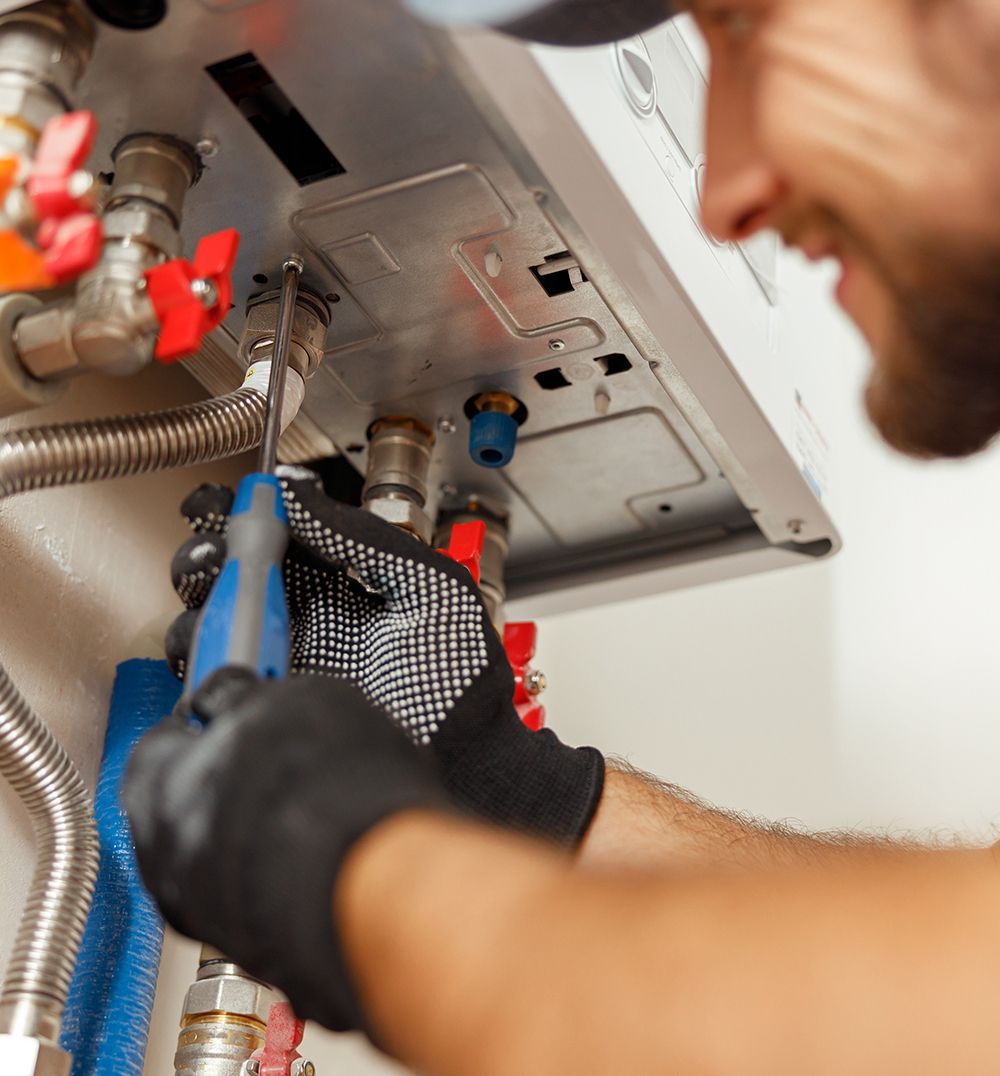 plumber fixing water heater