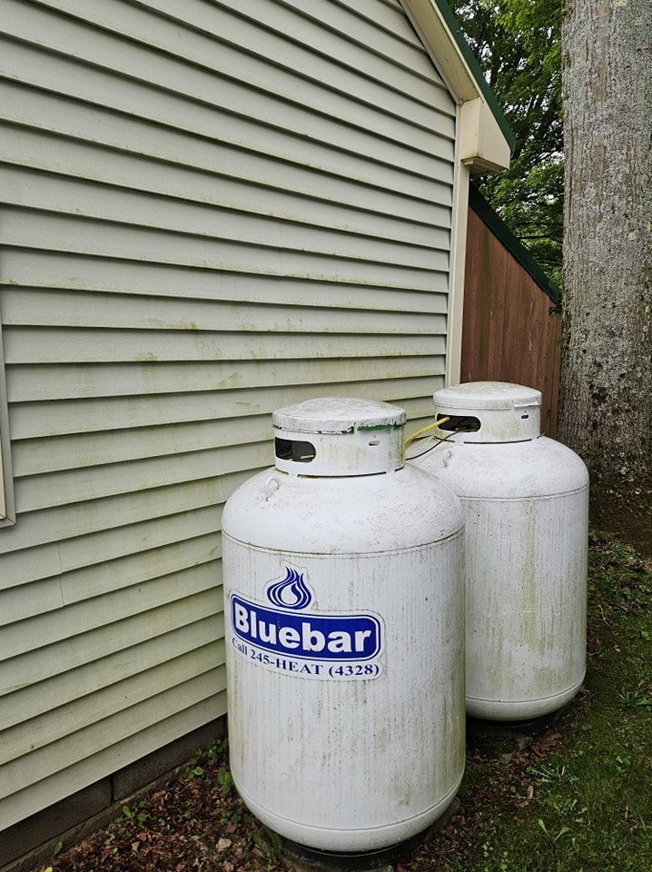 Two large, white propane tanks labeled 