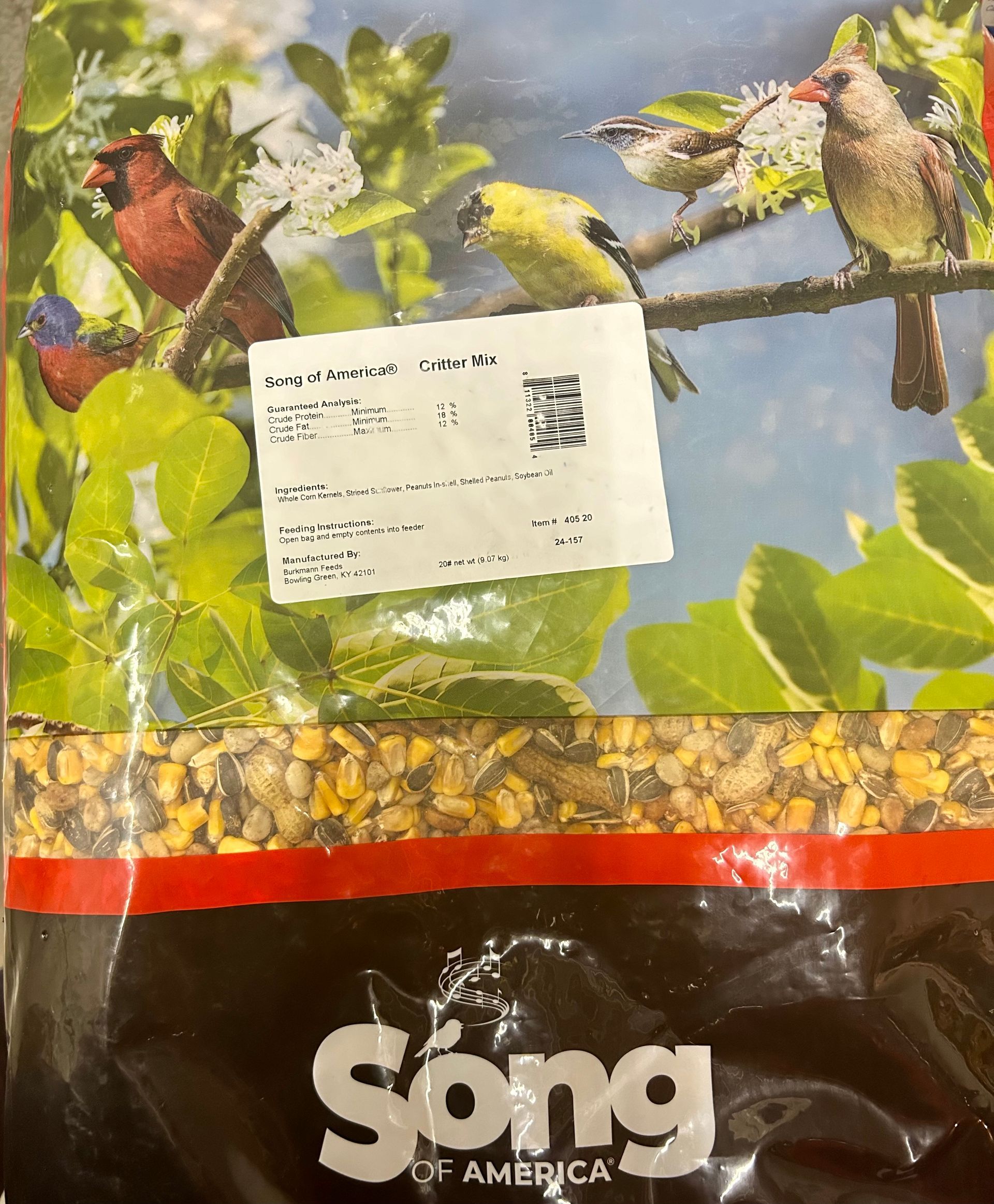 Bag of Song birdseed with colorful birds depicted on the front. A label with text is visible.