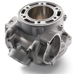 A close up of a metal engine head on a white background