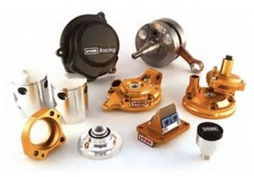 A bunch of motorcycle performance parts on a white surface