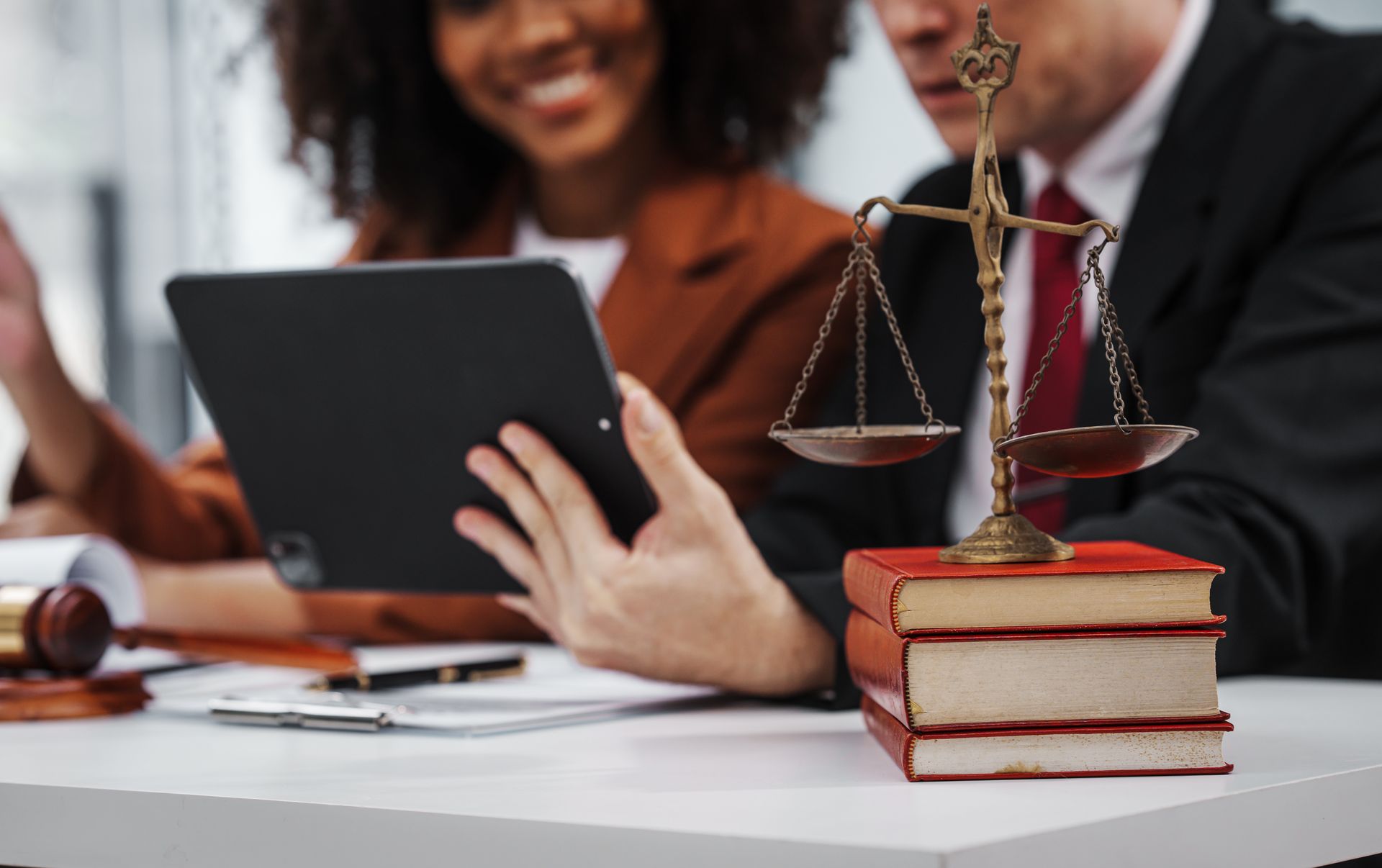 Personal Injury Lawyer reviewing a client's case documents at a desk
