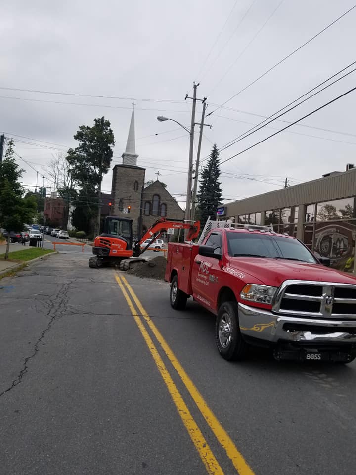 Car & Excavator — Wurtsboro, New York — MDL Excavating Landscaping LLC