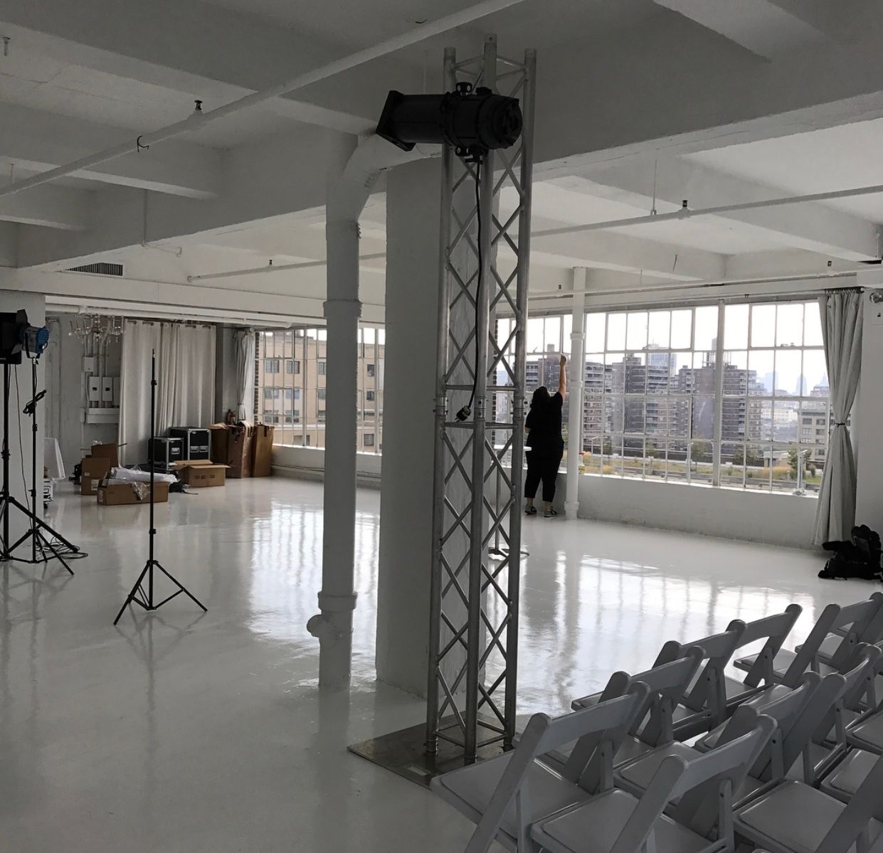 A large white room with a lot of chairs.