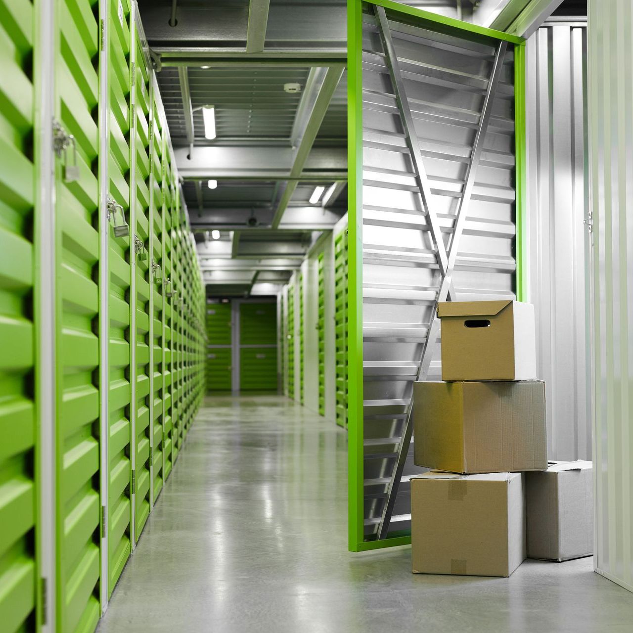 several cardboard boxes are stacked on top of each other in a hallway