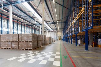 a large warehouse has a checkered pattern on the floor