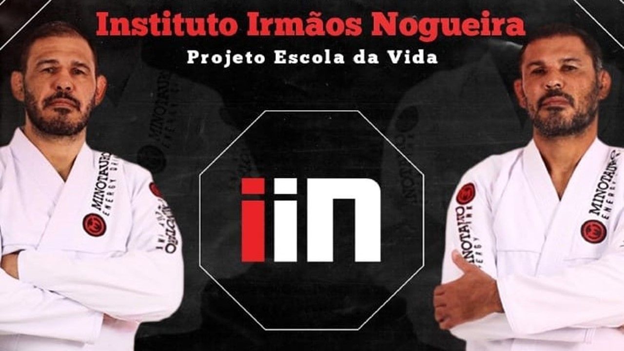 Dois homens estão um ao lado do outro em frente a uma placa que diz instituto irmãos nogueira