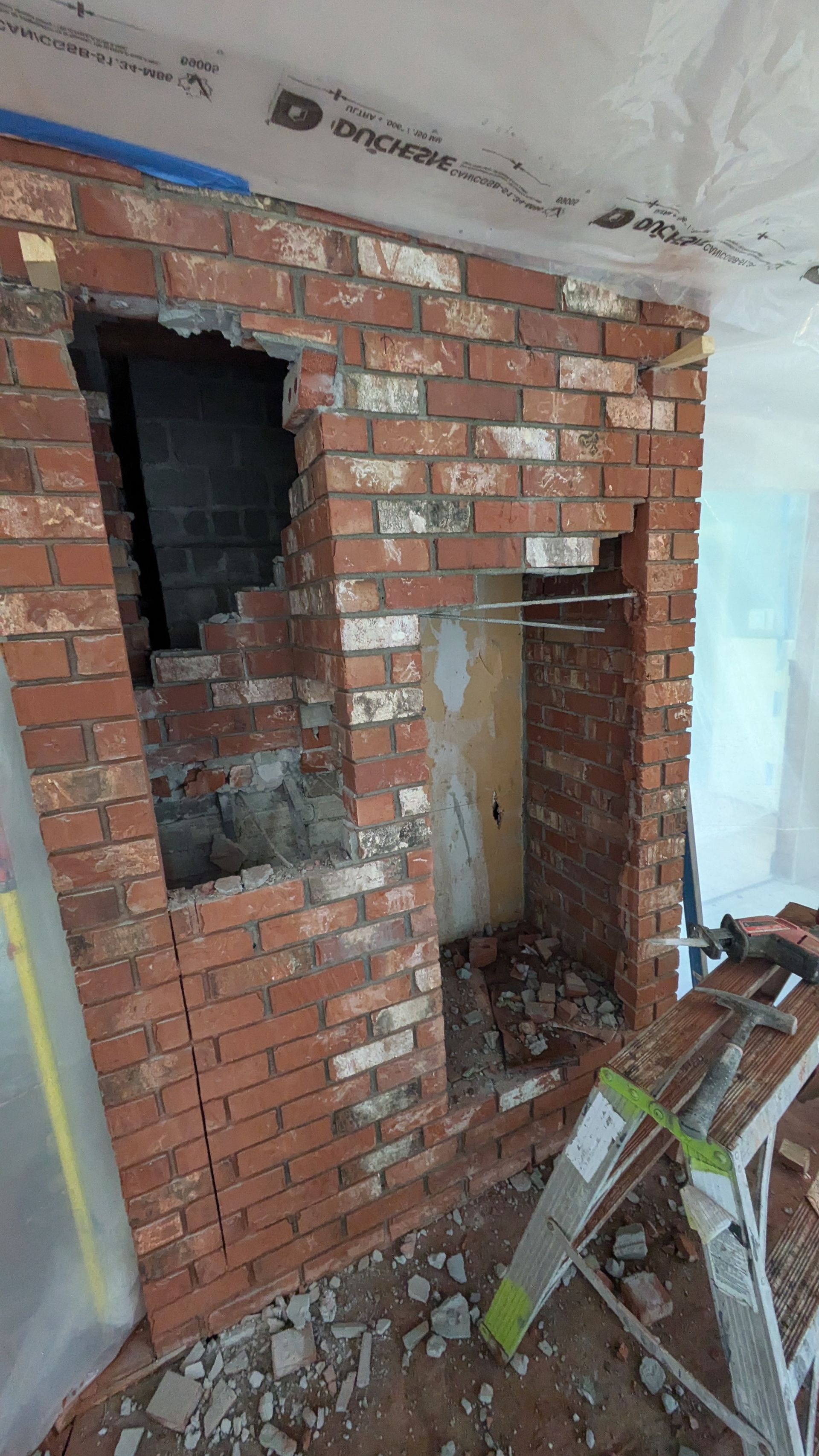 Removing bricks from old fireplace