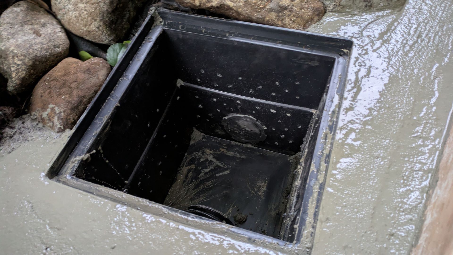Drainage system being installed with wet concrete