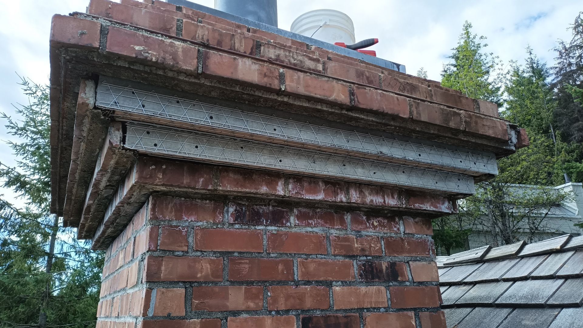 Brick chimney being restored and repaired