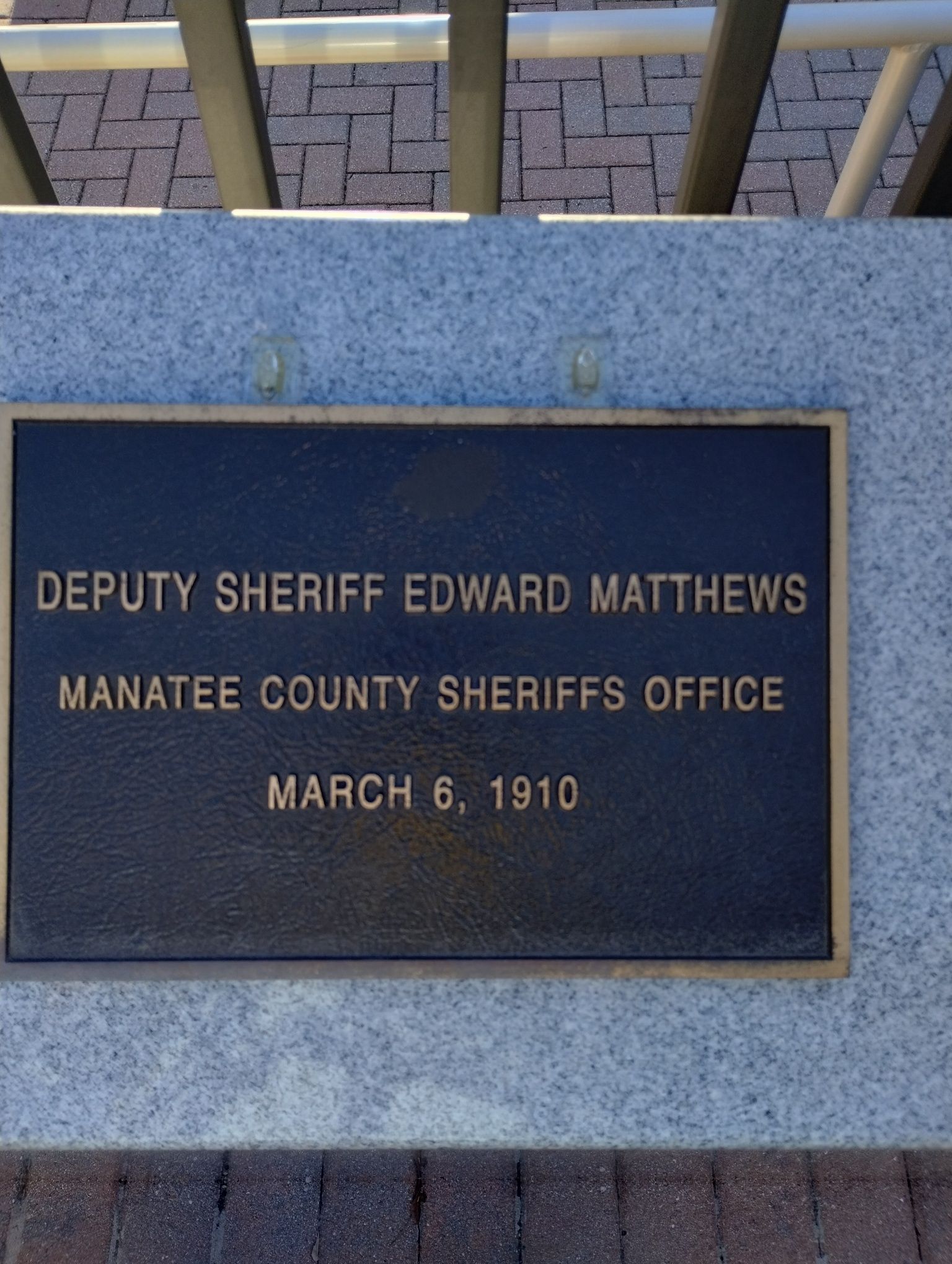 A sign that says deputy sheriff edward matthews on it