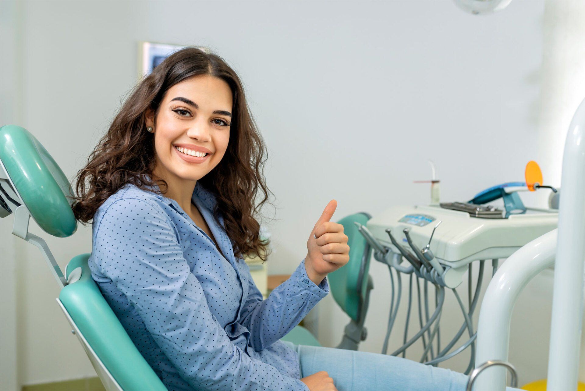 Woman Giving Thumbs Up — Jackson Heights, NY — Vanguard and Achury Dental