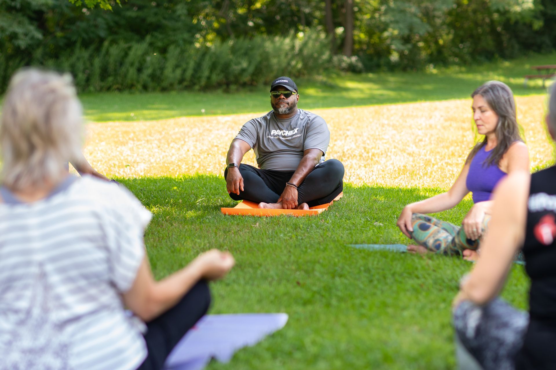 Yoga and meditation classes at work to reduce stress and improve wellness.