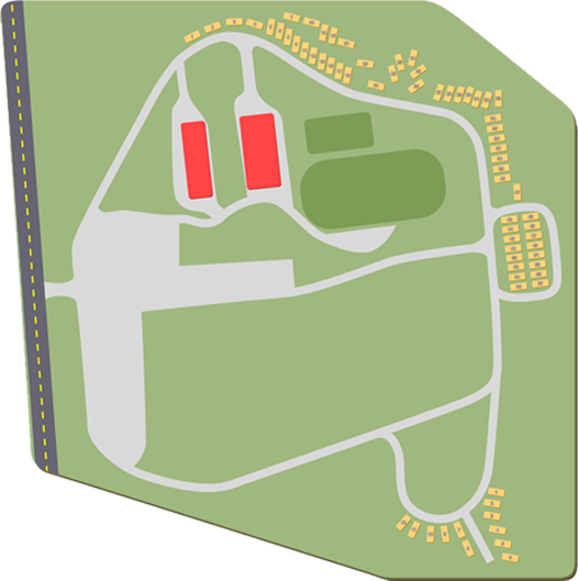 Stylized map of a park with roads, green fields, red buildings, and yellow parking areas
