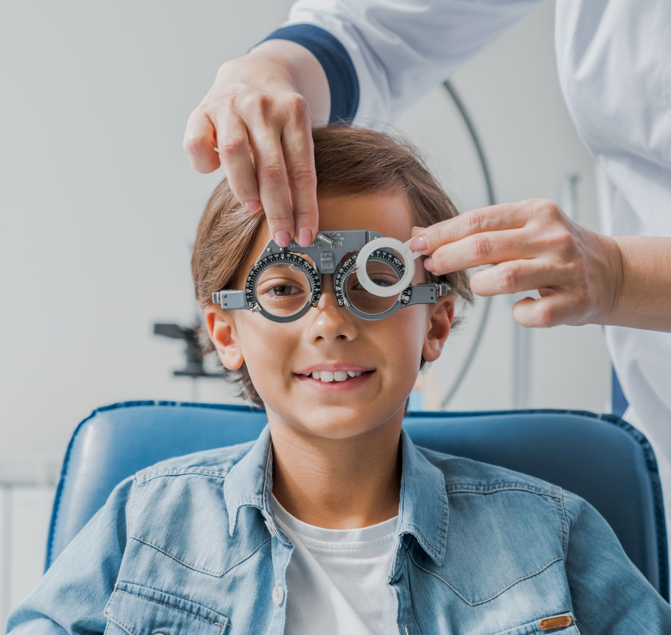 young boy getting an eye exam