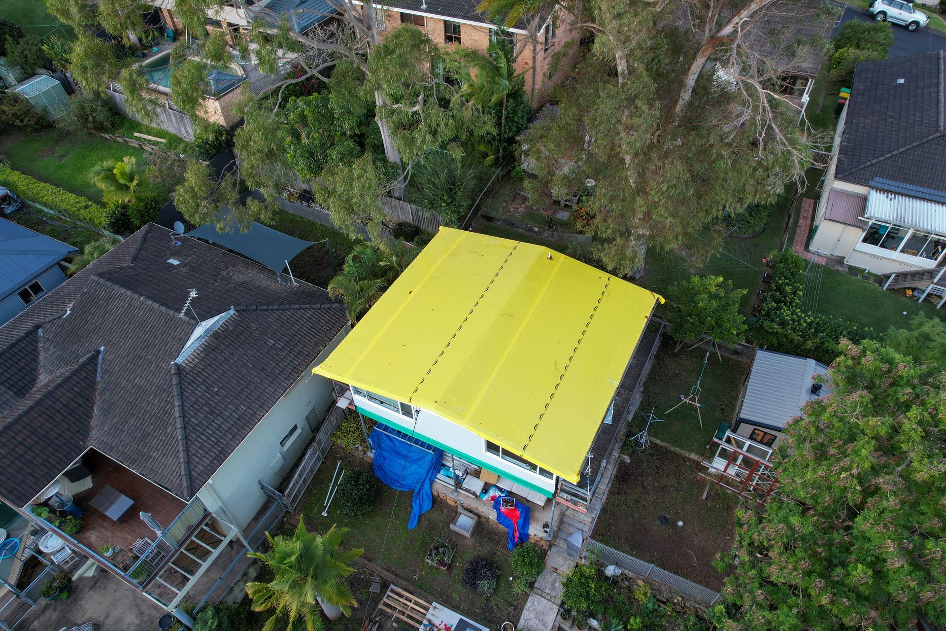 A Close Up Of A Gutter On The Roof Of A House — Asbestos Risk Removal In Gladstone, QLD