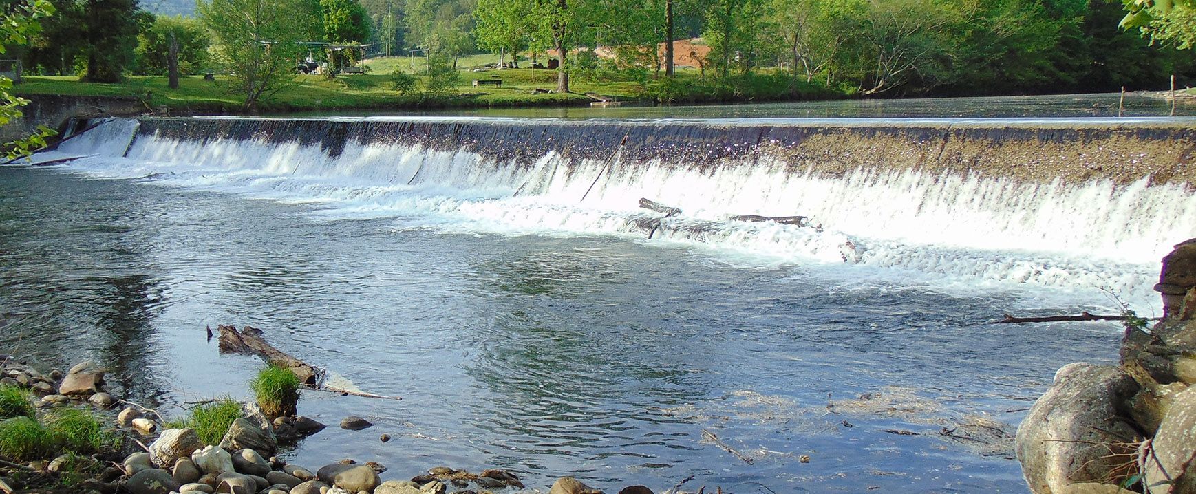 A river with a waterfall in the middle of it