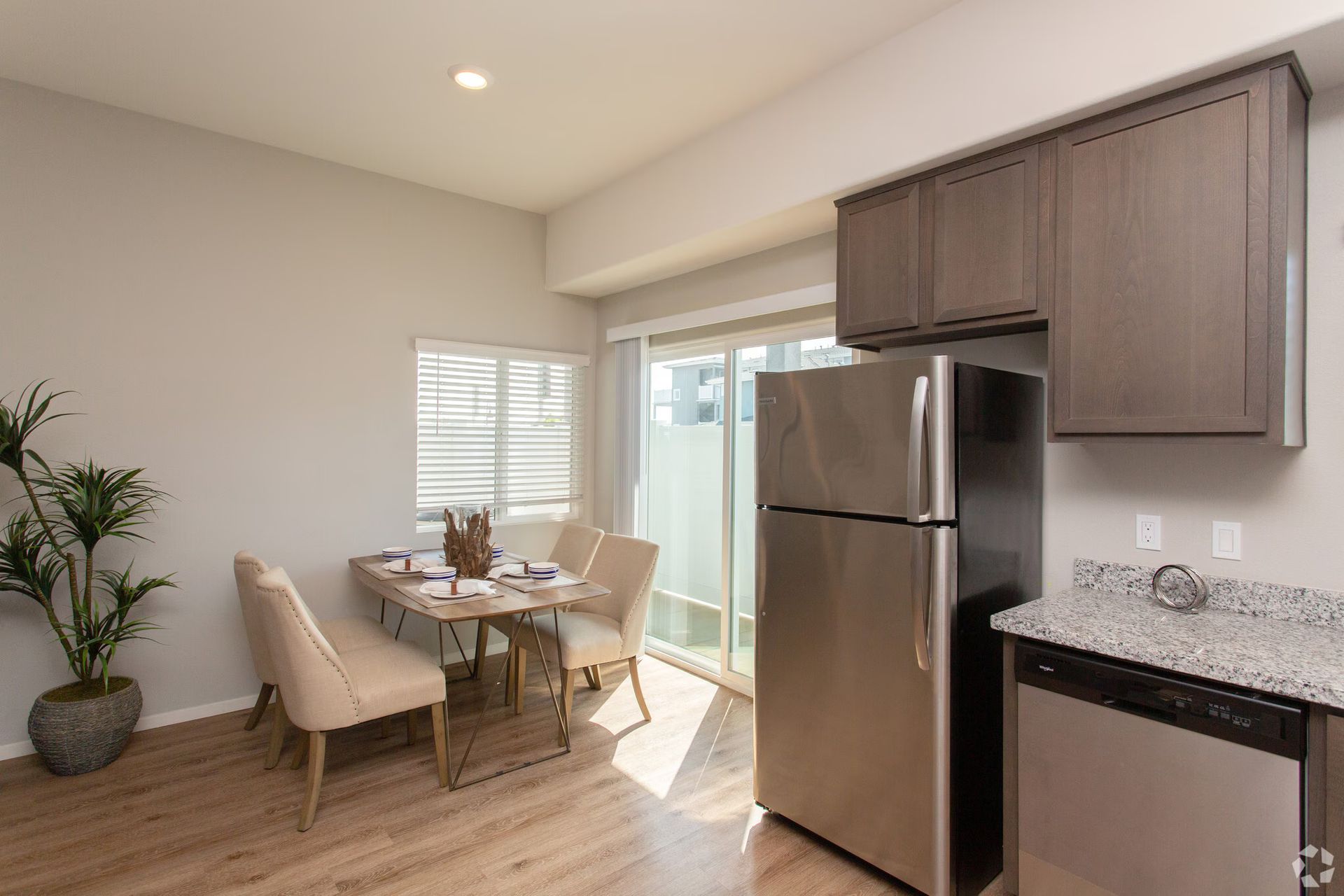 Photo showing a kitchen with a small dining area next to it