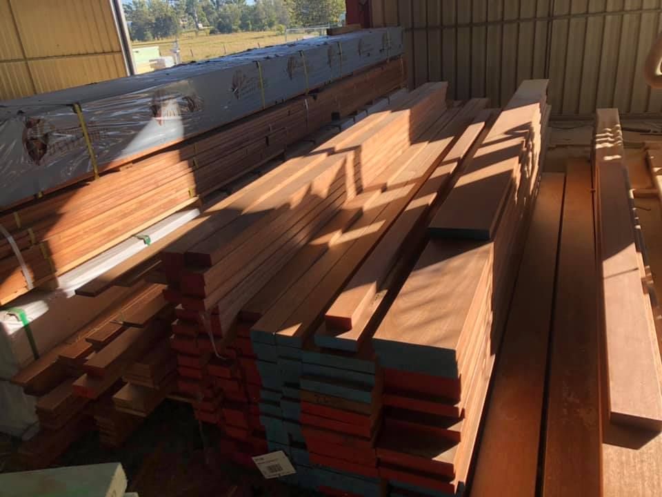 Stacks of Lumber Inside a Warehouse — Premium Trusses In South Grafton, NSW