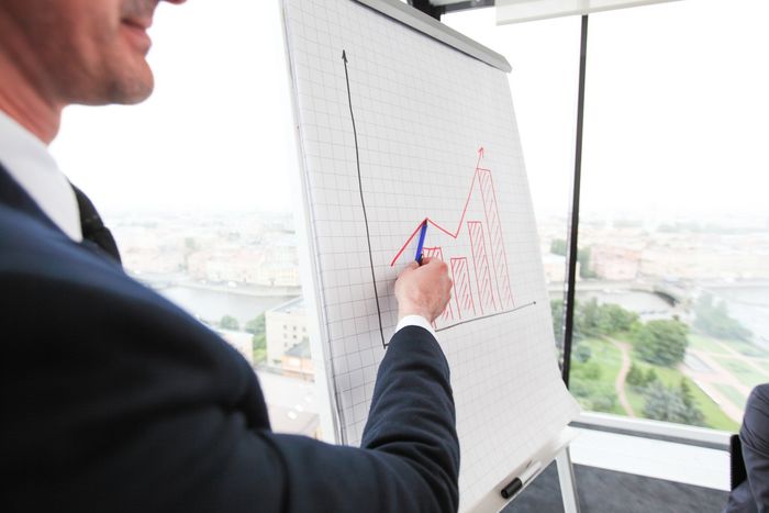 man pointing at the graph