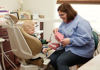 Dentist with Little Boy — Quincy, MI — Family Dental Home Dentist with Little Boy — Quincy, MI — Family Dental Home