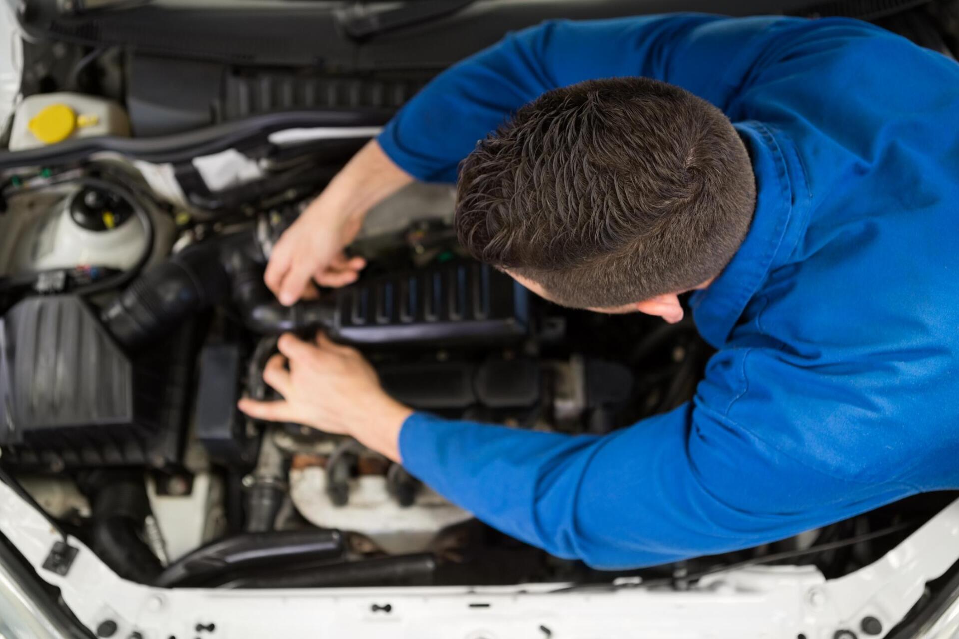 man working on engine