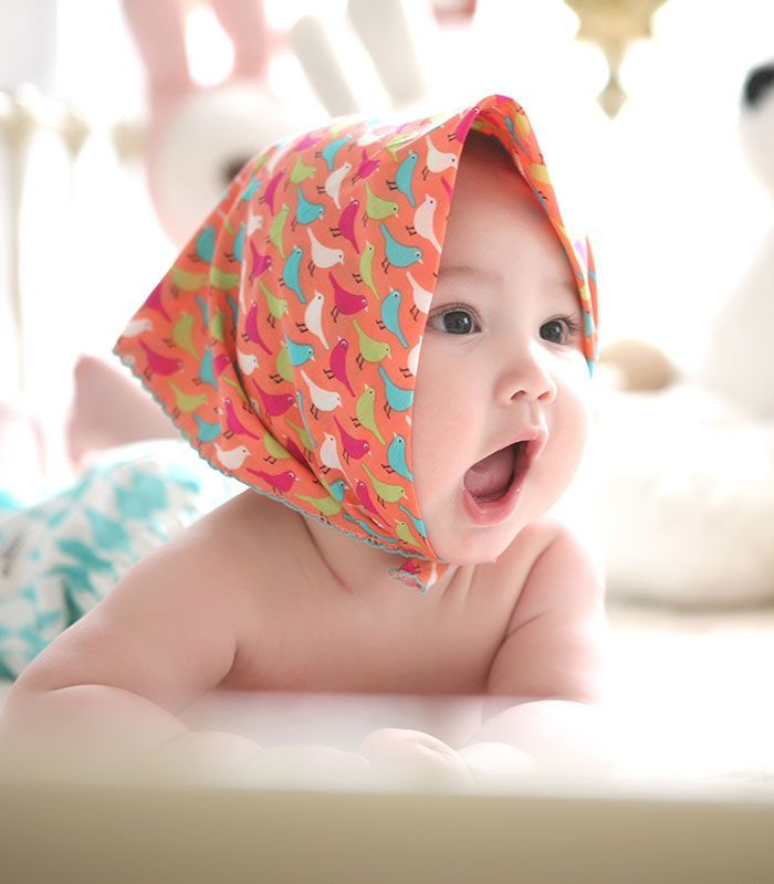 Baby lying on its stomach and yawning