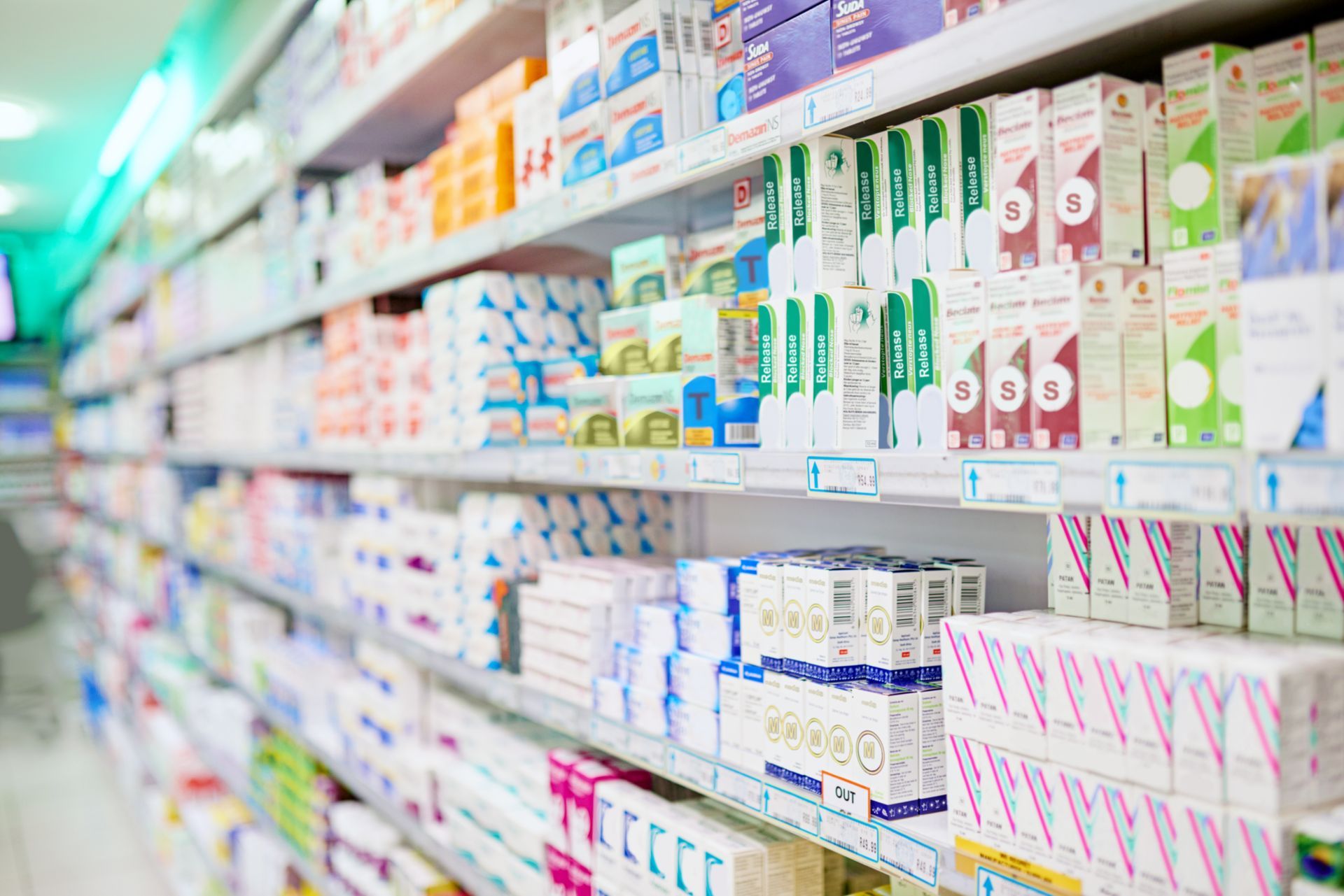 A pharmacy aisle filled with lots of different types of medications.