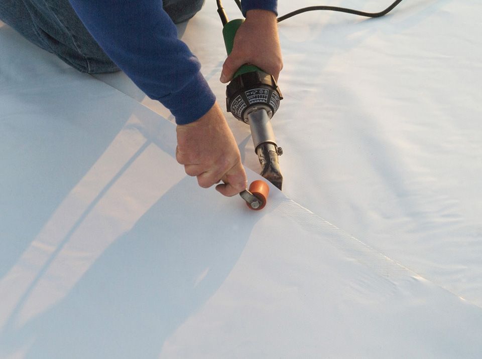 commercial roof being welded in salina ks