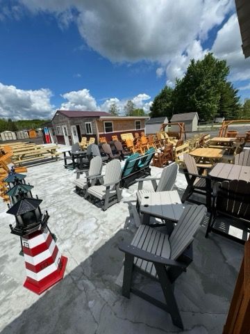 A bunch of chairs and tables are sitting on a patio.