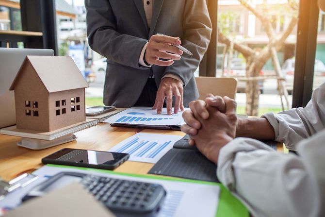 Real estate broker discussing with client
