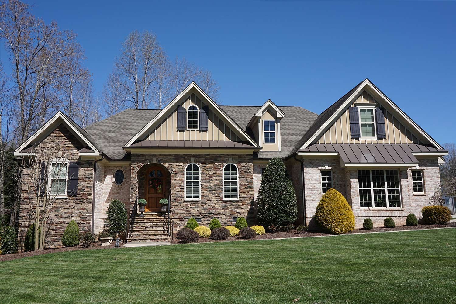 Large stone-and-siding suburban house