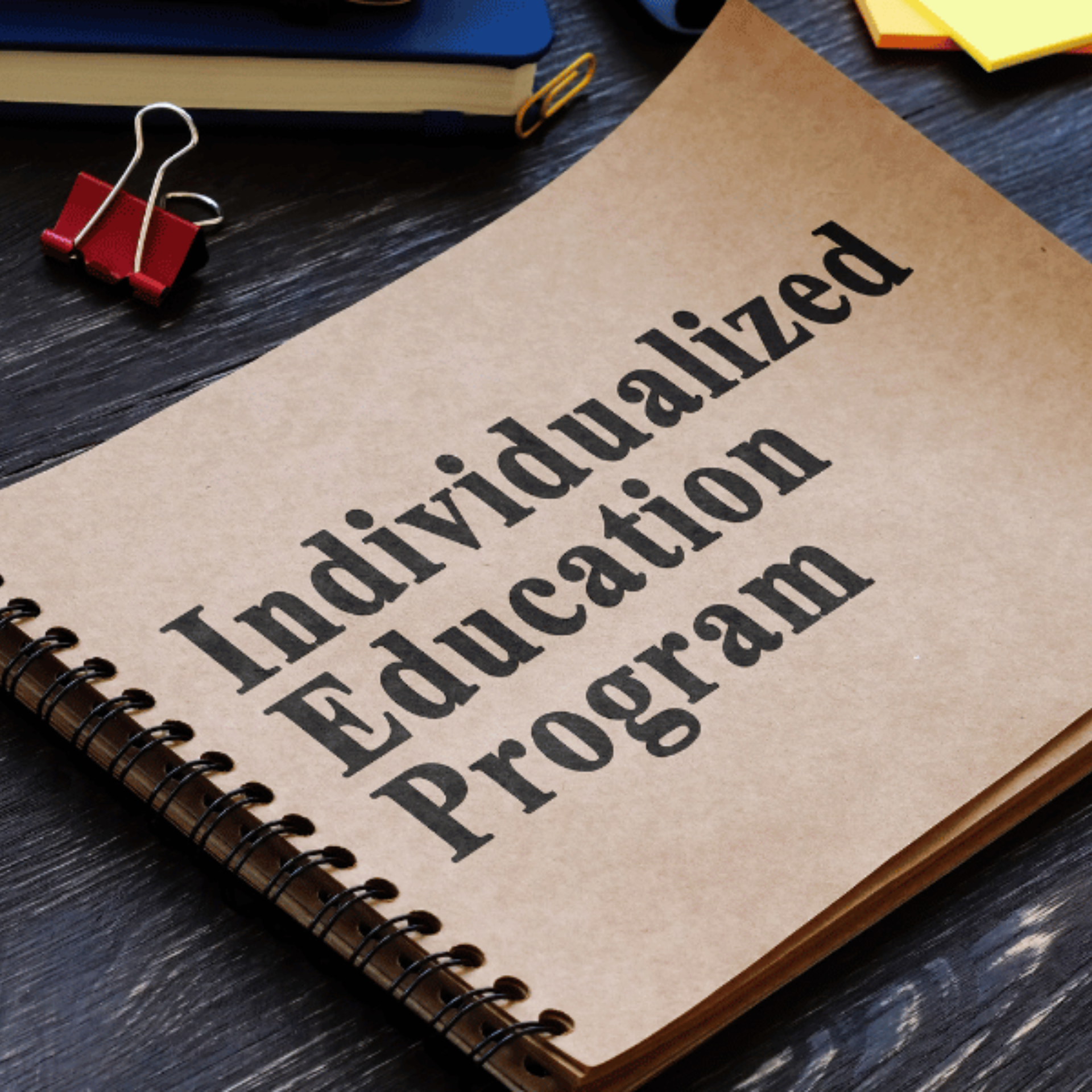 A notebook with the words individualized education program written on it