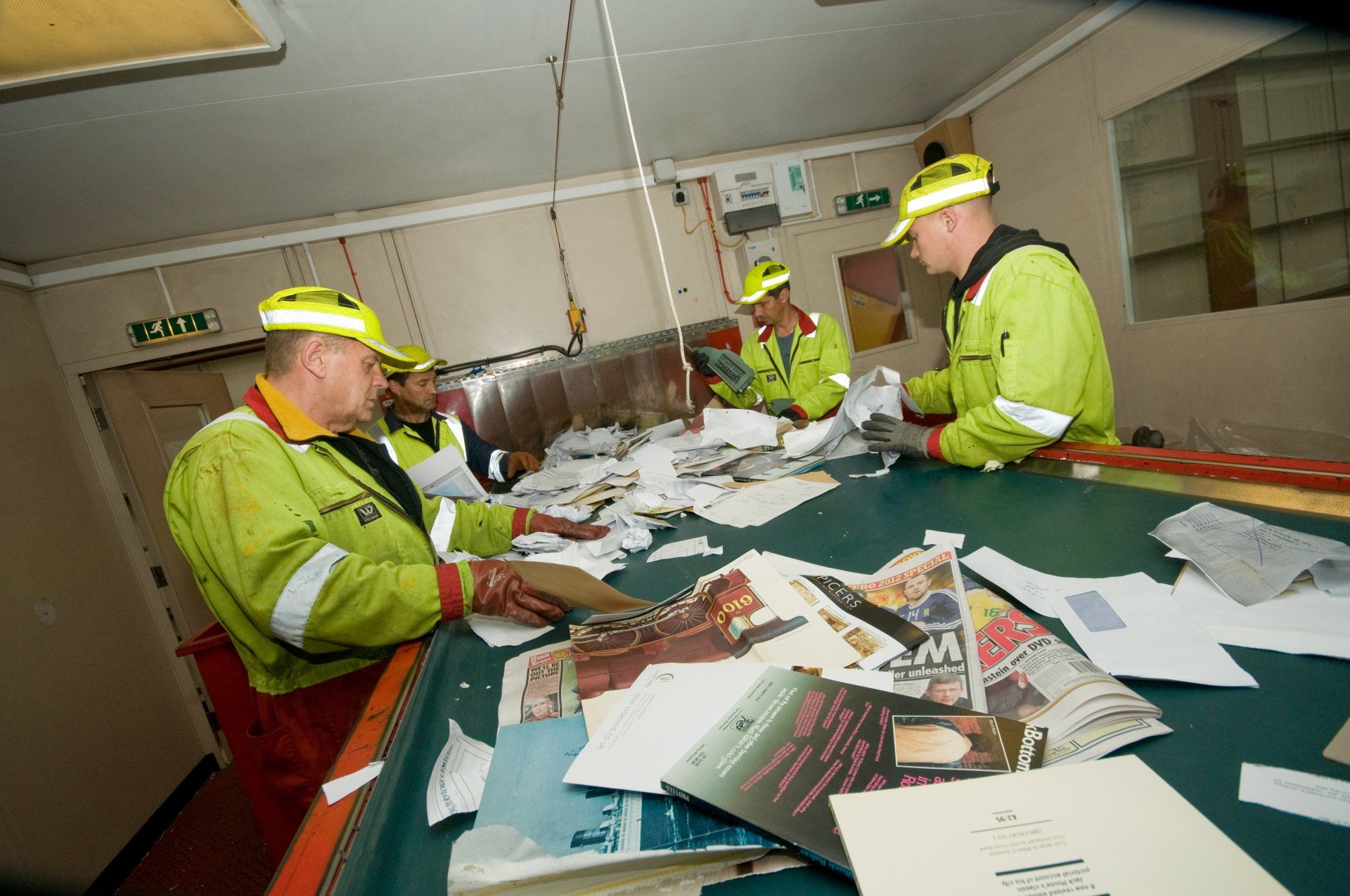 newspapers and other papers being sorted