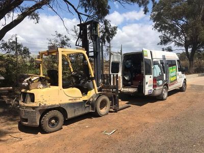 Yellow Forklift is Parked Next to a White Van — Bundaberg Forklift Repairs Mundubbera, QLD
