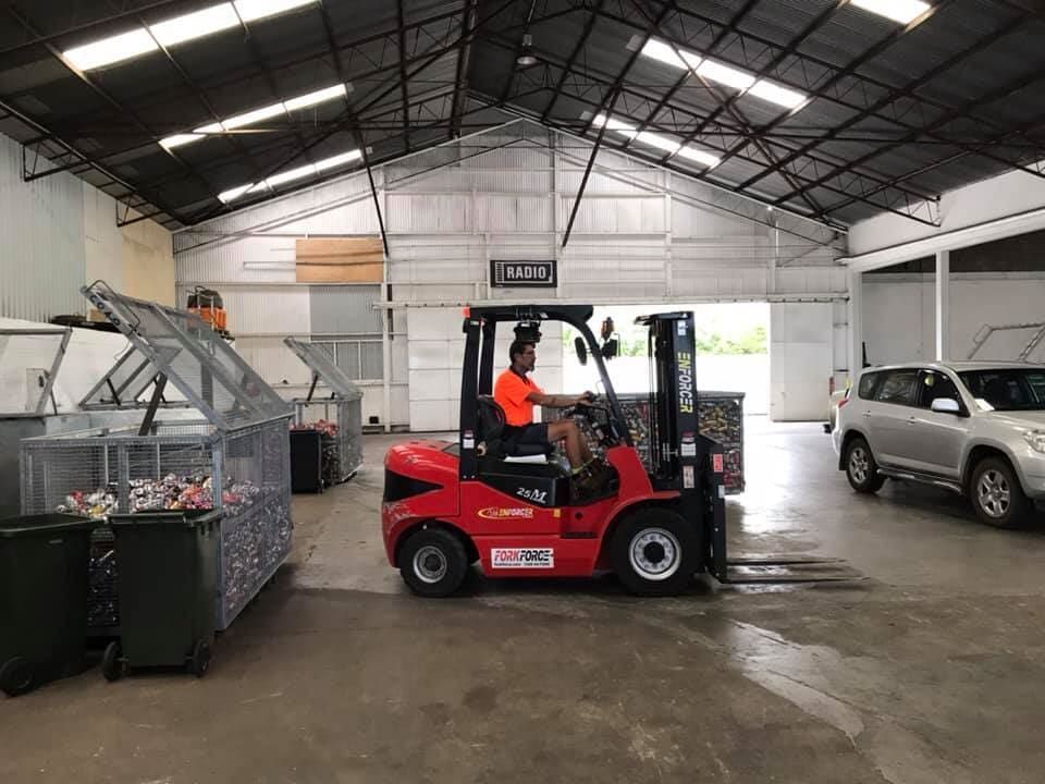 Man is Driving a Forklift in a Warehouse — Bundaberg Forklift Repairs Bundaberg North, QLD