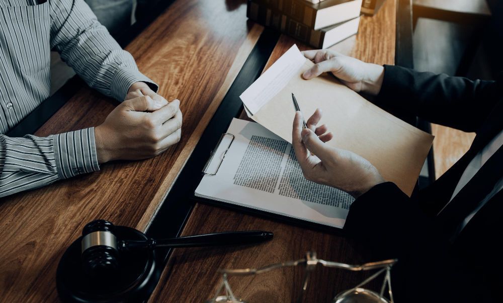 People reviewing a contract in a folder
