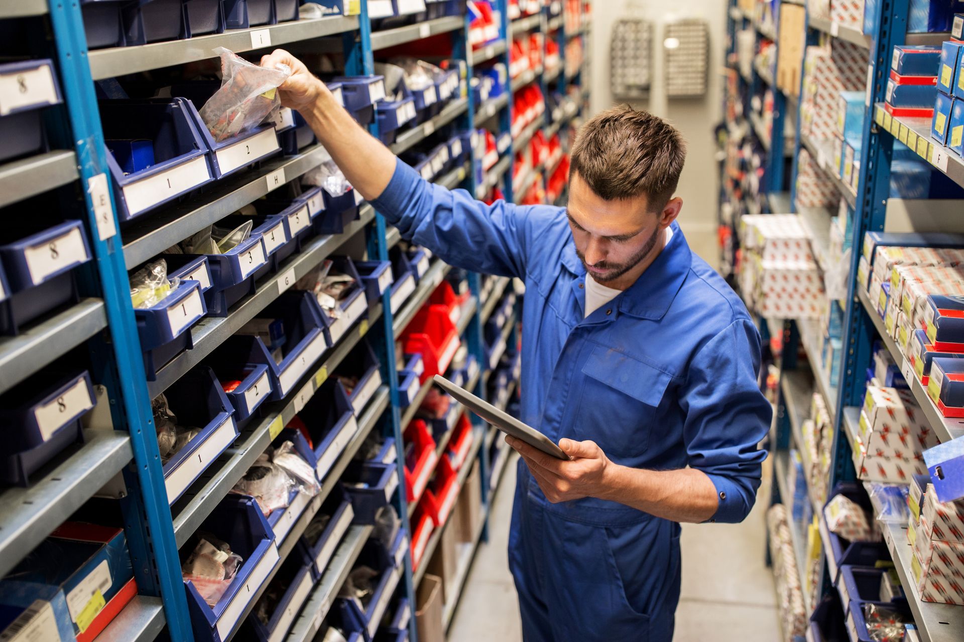 A technician looking for an auto part. Warehouse Inventory Audit