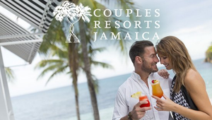 Couple toasting drinks at a seaside resort with palm trees and ocean view, Couples Resorts Jamaica logo