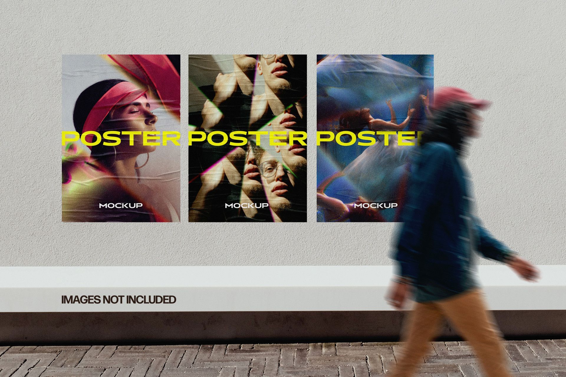 A mockup of three posters on a textured wall, with a blurred person walking past in the foreground.