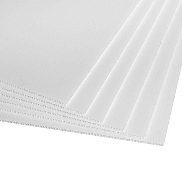 Stack of white, textured paper sheets, fanned out.