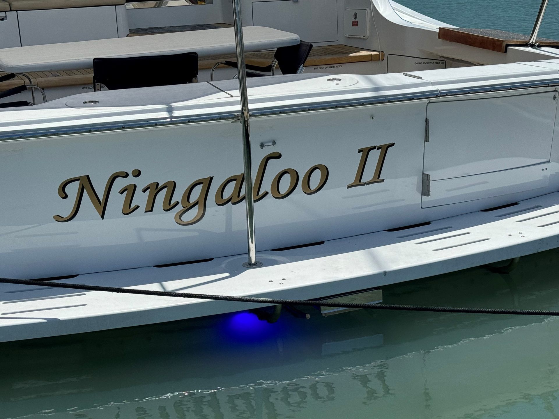 A White Yacht Stern with The Gold Lettering — On The Spot Signs Port Douglas In Port Douglas, QLD