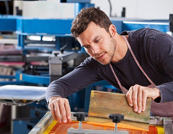 Man Using Screen Printing — Frankfort, IL — Action Sports