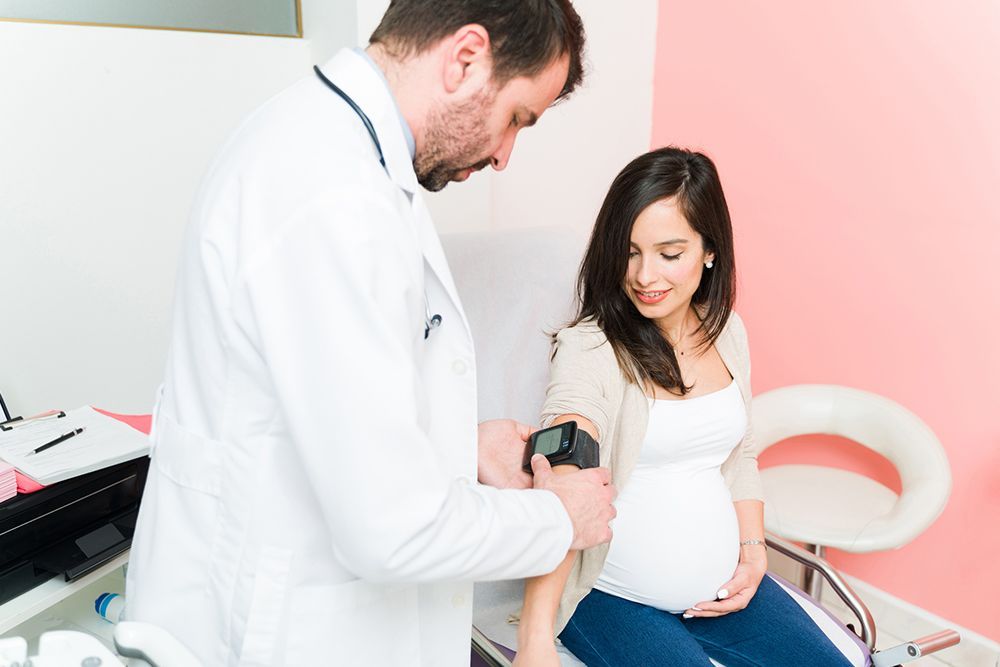 Pregnant Woman and Doctor | Asheville, NC | Grace OB/GYN Physicians