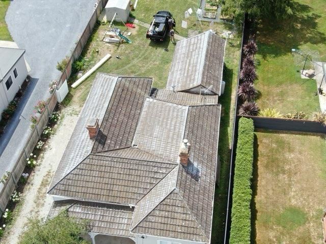front view of picture of house before roof replacement in launceston